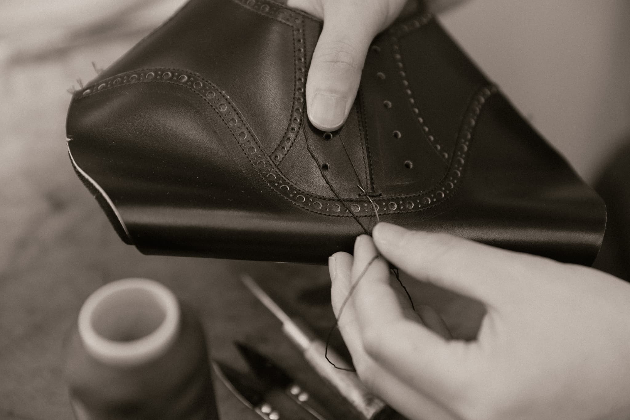 Bespoke shoe making. Upper construction. The shoemaker sews the upper leather using a sewing machine and specialised needles. The finer details are finished by hand at Yuki Shirahama Bottier