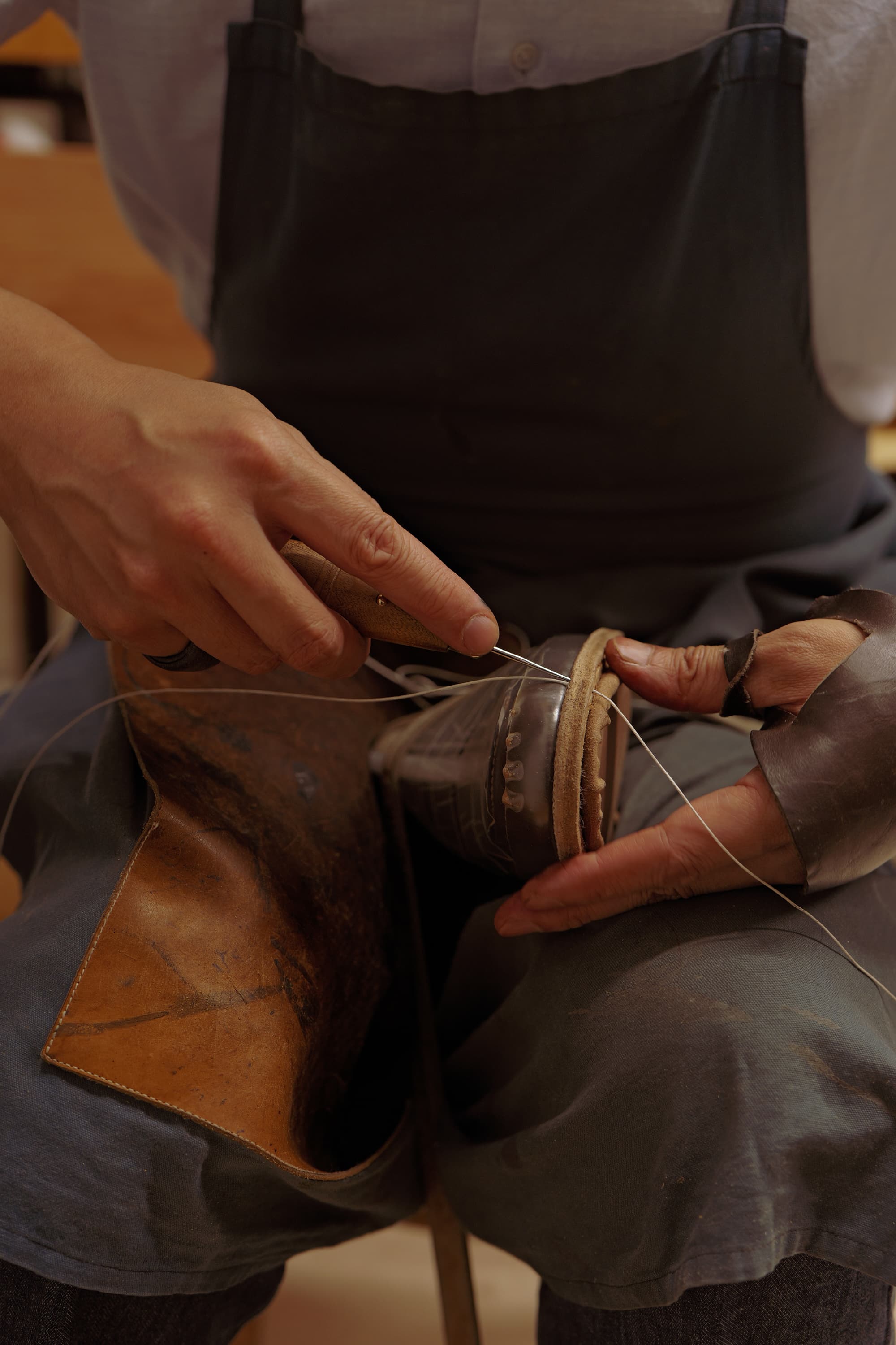 lasting process shaping leather on wooden last