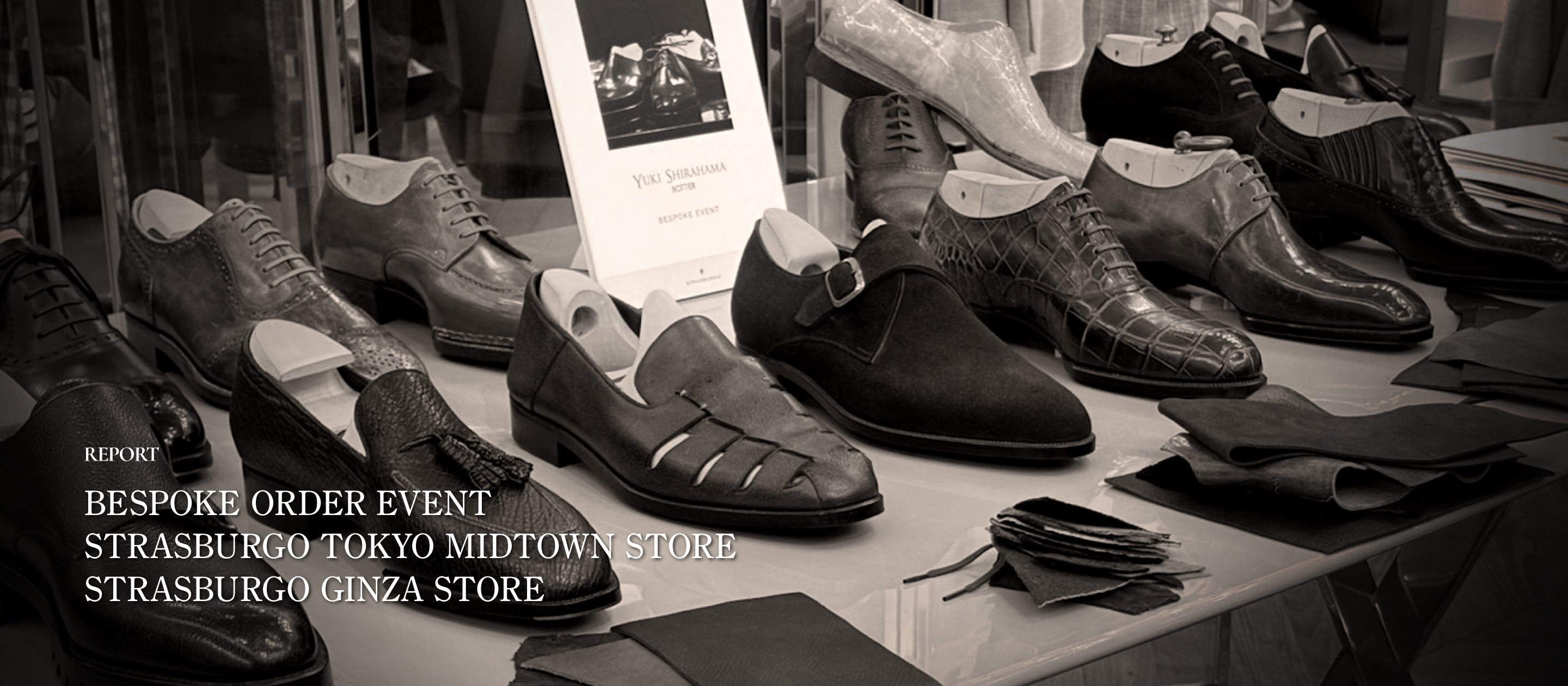 Monochrome photograph of various bespoke leather shoes on display at a trunk show, featuring the text "REPORT: BESPOKE ORDER EVENT - STRASBURGO TOKYO MIDTOWN STORE & STRASBURGO GINZA STORE".